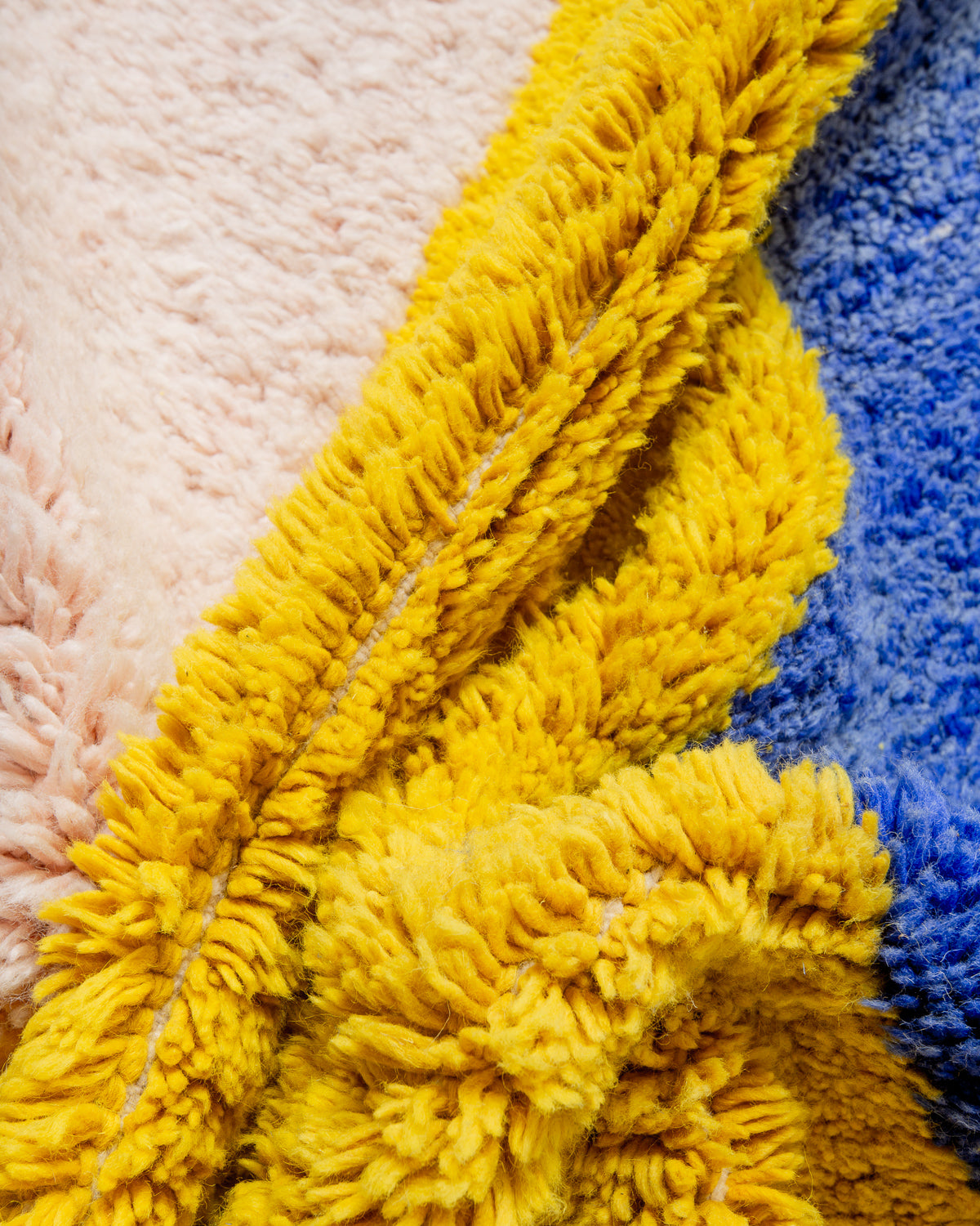 Modern, designer, handcrafted Berber rug from Morocco. Beniourain carpet with beautiful colours and patterns and fluffy wool texture.